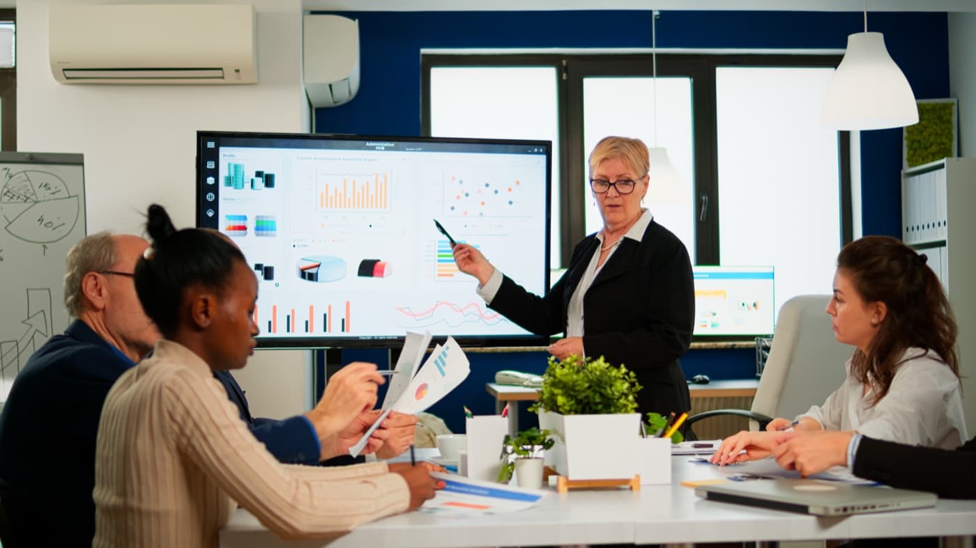 An OMC advisor presenting company structure options to a client team